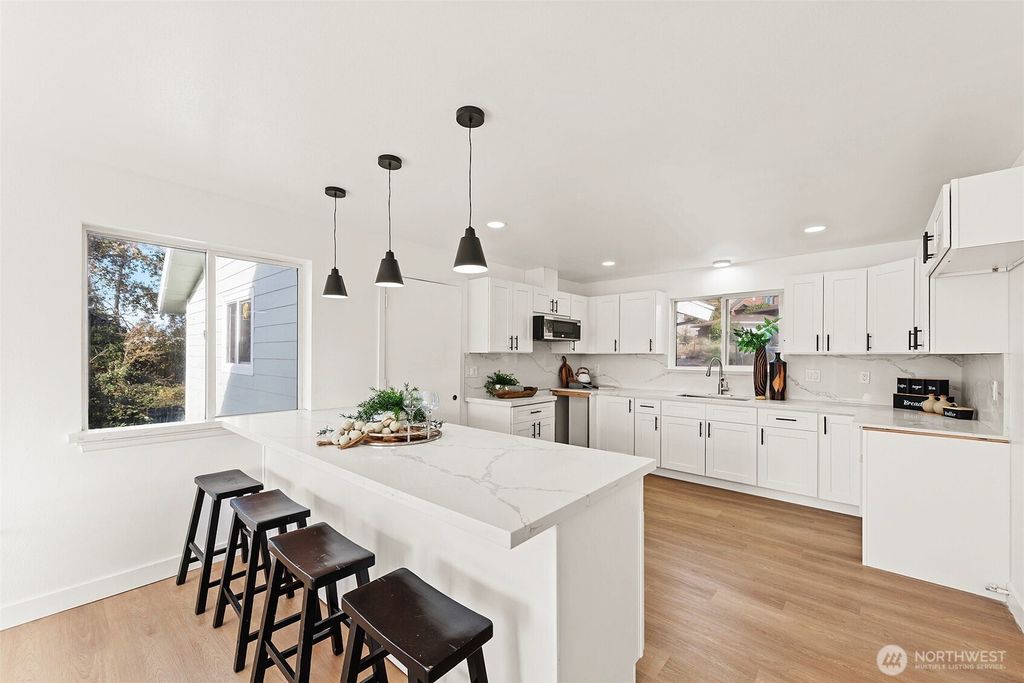 Photo of 8305 Duncan Ave S Ave, Seattle, WA 98118 (MLS # 2456116)