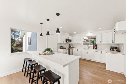 Photo of 8305 Duncan Ave S Ave, Seattle, WA 98118 (MLS # 2456116)