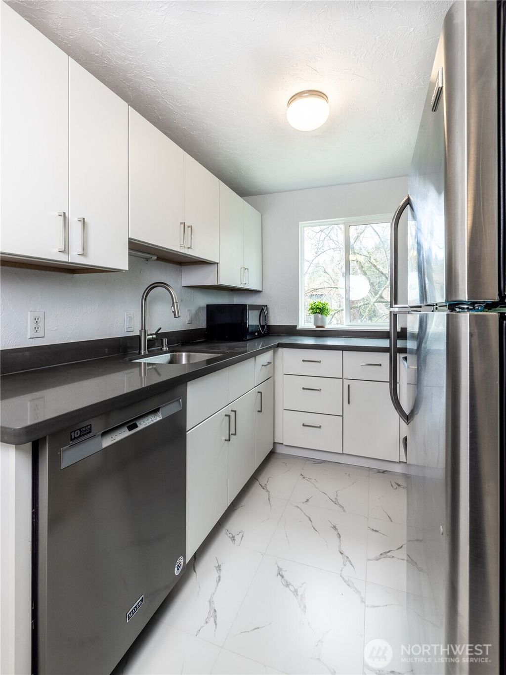 Photo of 2100 N 106th St #307, Seattle, WA 98133 (MLS # 2470948)