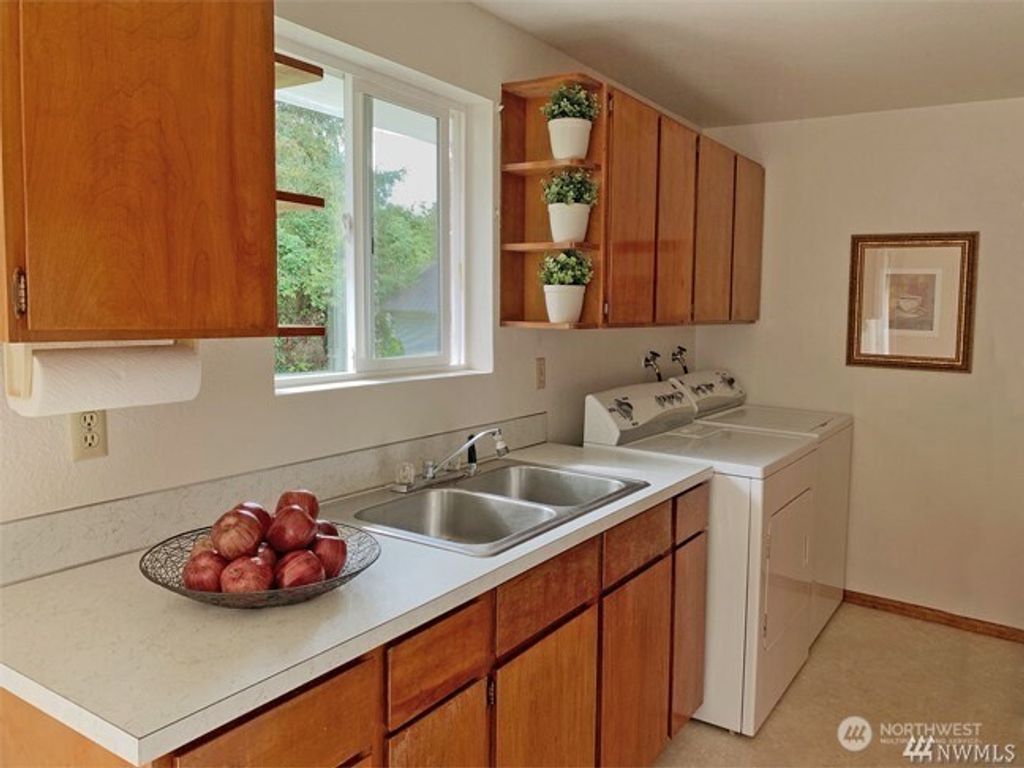 Photo of 2119 SW Cloverdale Street, Seattle, WA 98106 (MLS # 2472468)