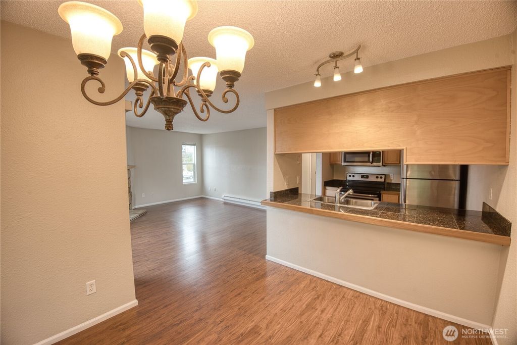 Photo of 3233 NE 12th Street #301, Renton, WA 98056 (MLS # 2448412)
