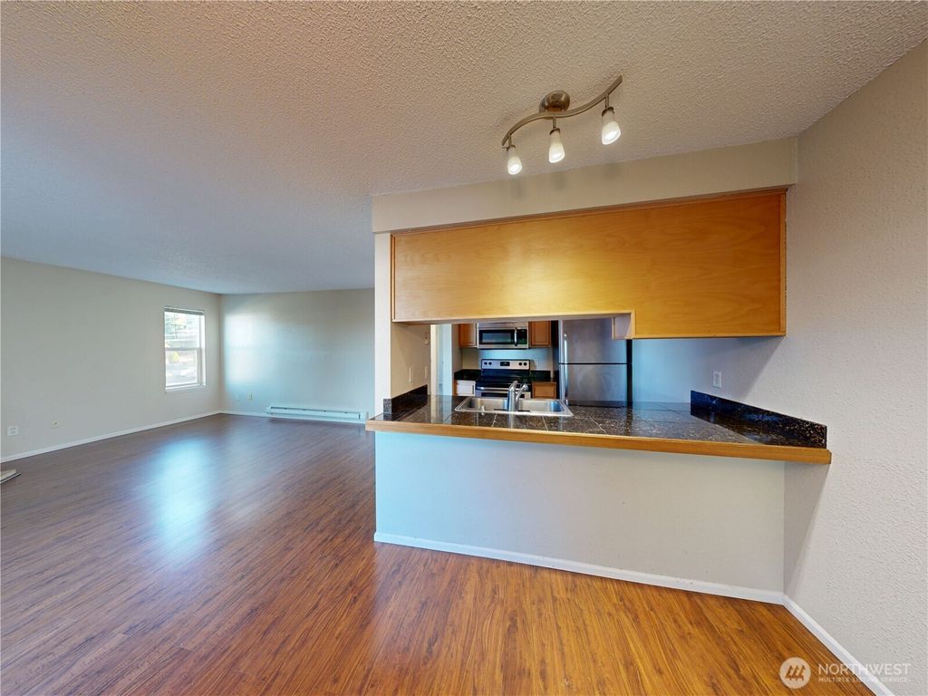 Photo of 3233 NE 12th Street #301, Renton, WA 98056 (MLS # 2448412)