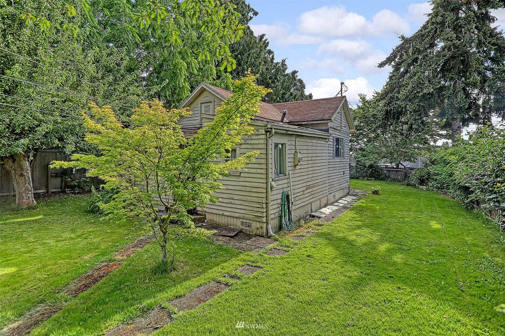 Photo of 7711 34th Avenue SW, Seattle, WA 98126 (MLS # 1970408)