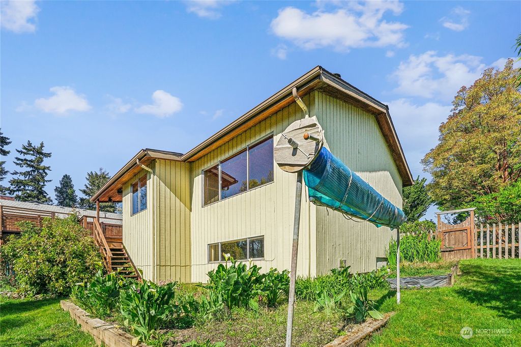 Photo of 8663 Island Drive S, Seattle, WA 98118 (MLS # 2233099)