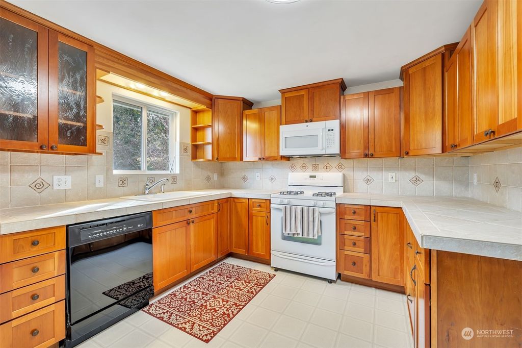 Photo of 4648 S 166th Street, SeaTac, WA 98188 (MLS # 2046405)