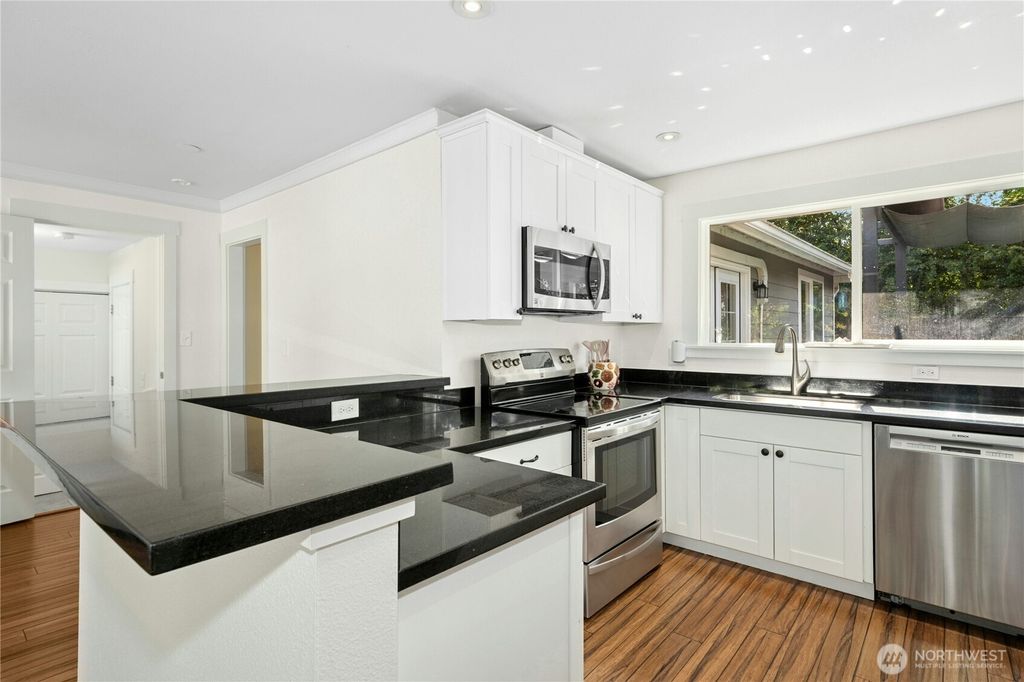 Photo of 9359 31st Place SW, Seattle, WA 98126 (MLS # 2398652)