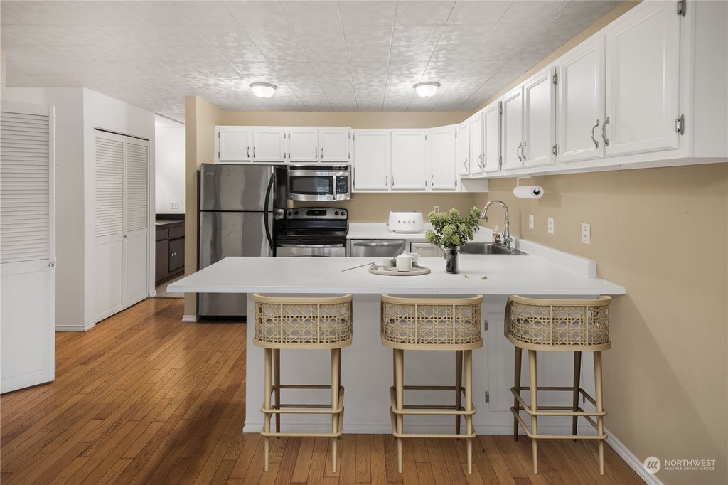 Photo of 6309 Sand Point Way NE #E5, Seattle, WA 98115 (MLS # 2310206)