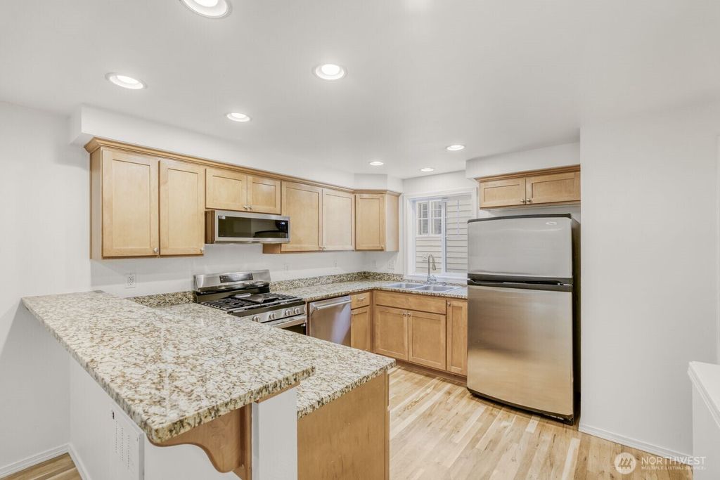 Photo of 12323 10th Place Pl NE #C, Seattle, WA 98125 (MLS # 2468585)