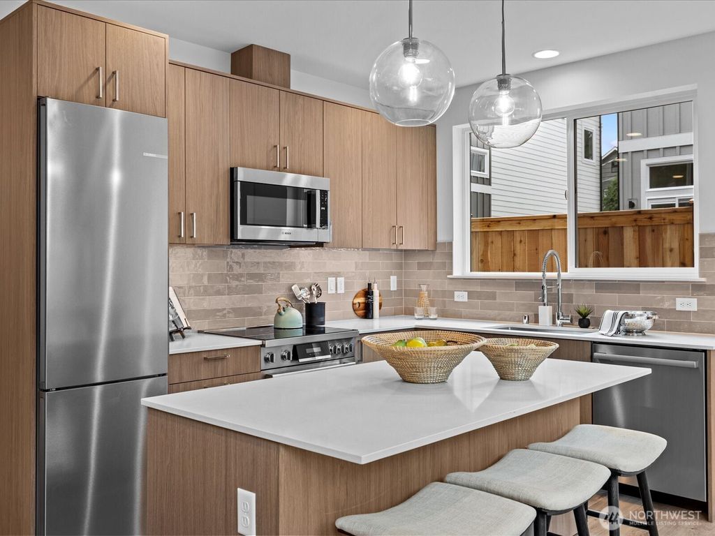 Photo of 9019 Dibble Avenue NW #B, Seattle, WA 98117 (MLS # 2408431)