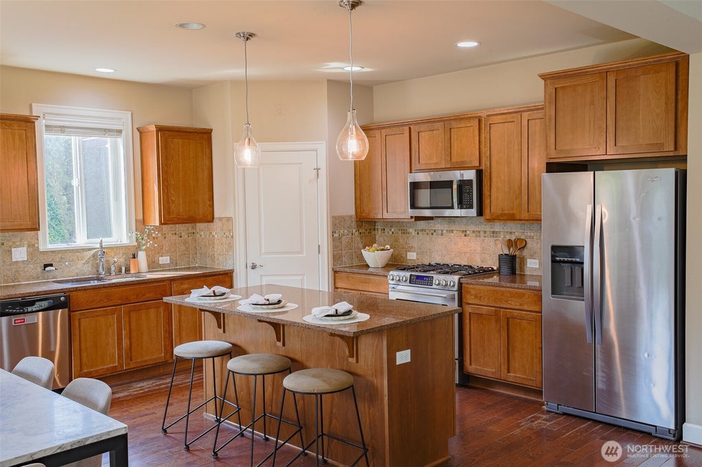 Photo of 208 Ilwaco Place SE, Renton, WA 98059 (MLS # 2574679)