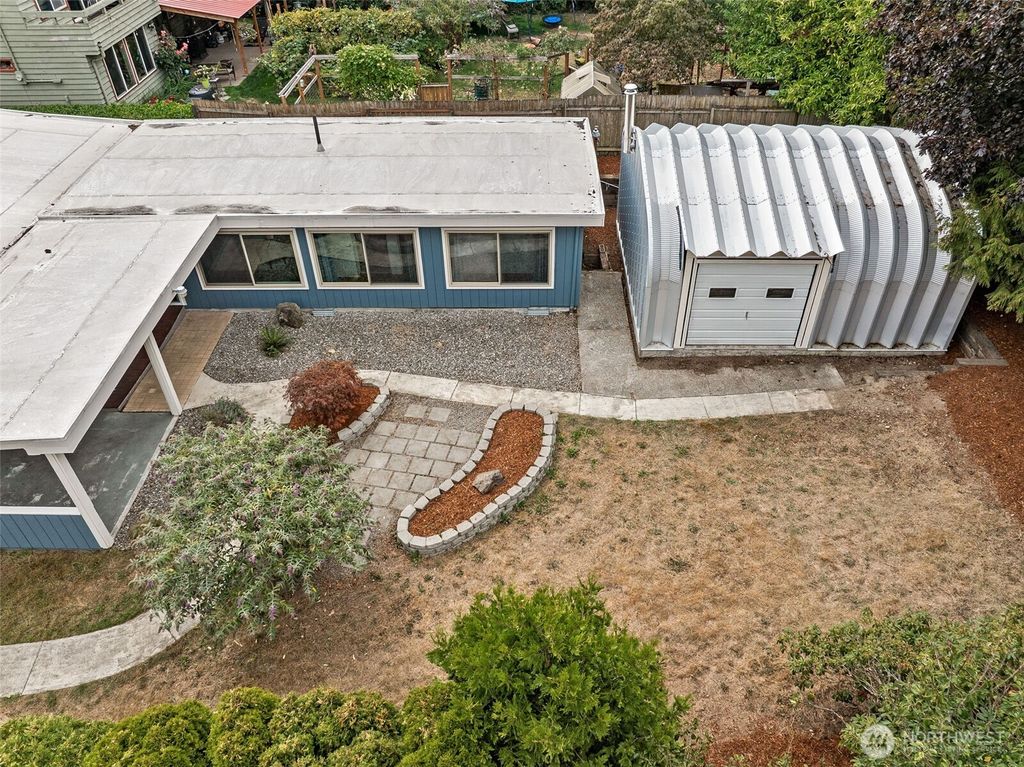 Photo of 10705 11th Avenue SW, Seattle, WA 98146 (MLS # 2424647)