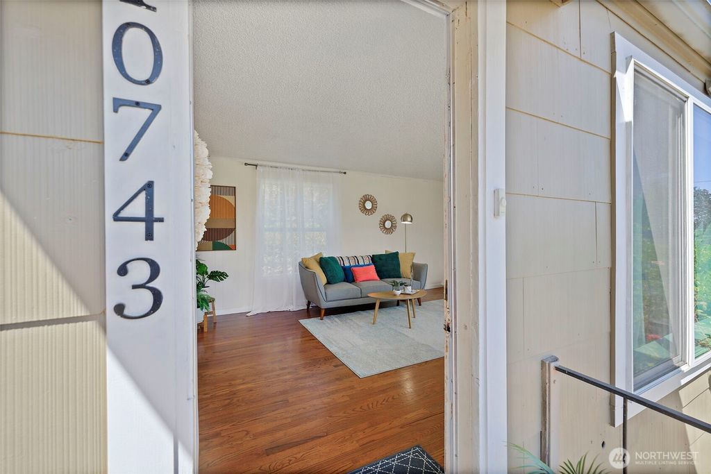 Photo of 10743 14th Avenue SW, Seattle, WA 98146 (MLS # 2414548)