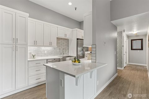 Photo of 1100 Harrington Ave NE Ave #306, Renton, WA 98056 (MLS # 2443074)