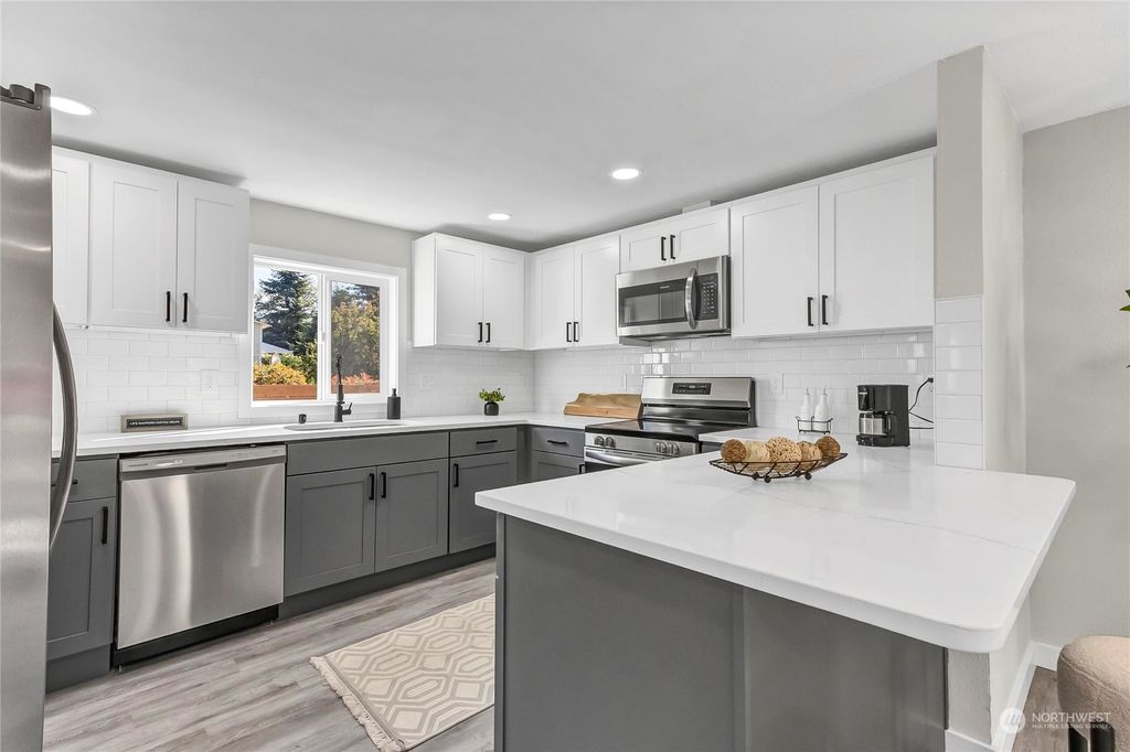 Photo of 9708 30th Avenue SW, Seattle, WA 98126 (MLS # 2320183)