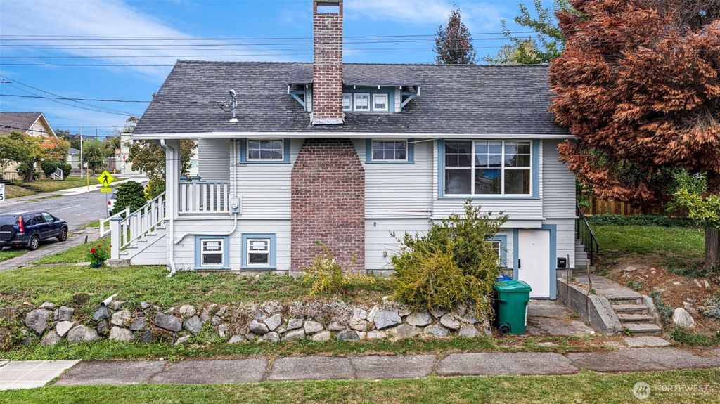 Photo of 7400 32nd Ave NW Ave, Seattle, WA 98117 (MLS # 2443636)