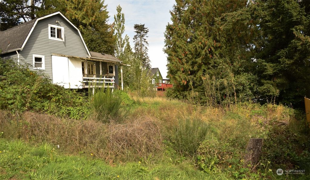 Photo of 12238 Military Road S, Seattle, WA 98168 (MLS # 2296708)