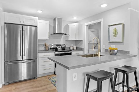 Photo of 15330 Sunwood Boulevard #E203, Tukwila, WA 98188 (MLS # 2444894)
