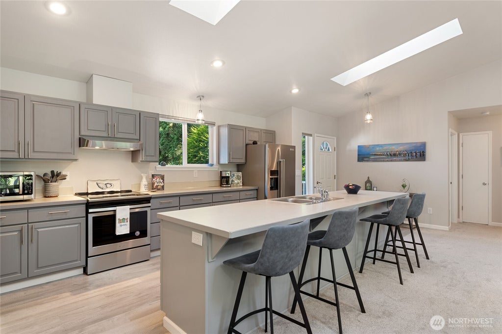 Photo of 41 E Rainier Drive, Allyn, WA 98524 (MLS # 2542463)