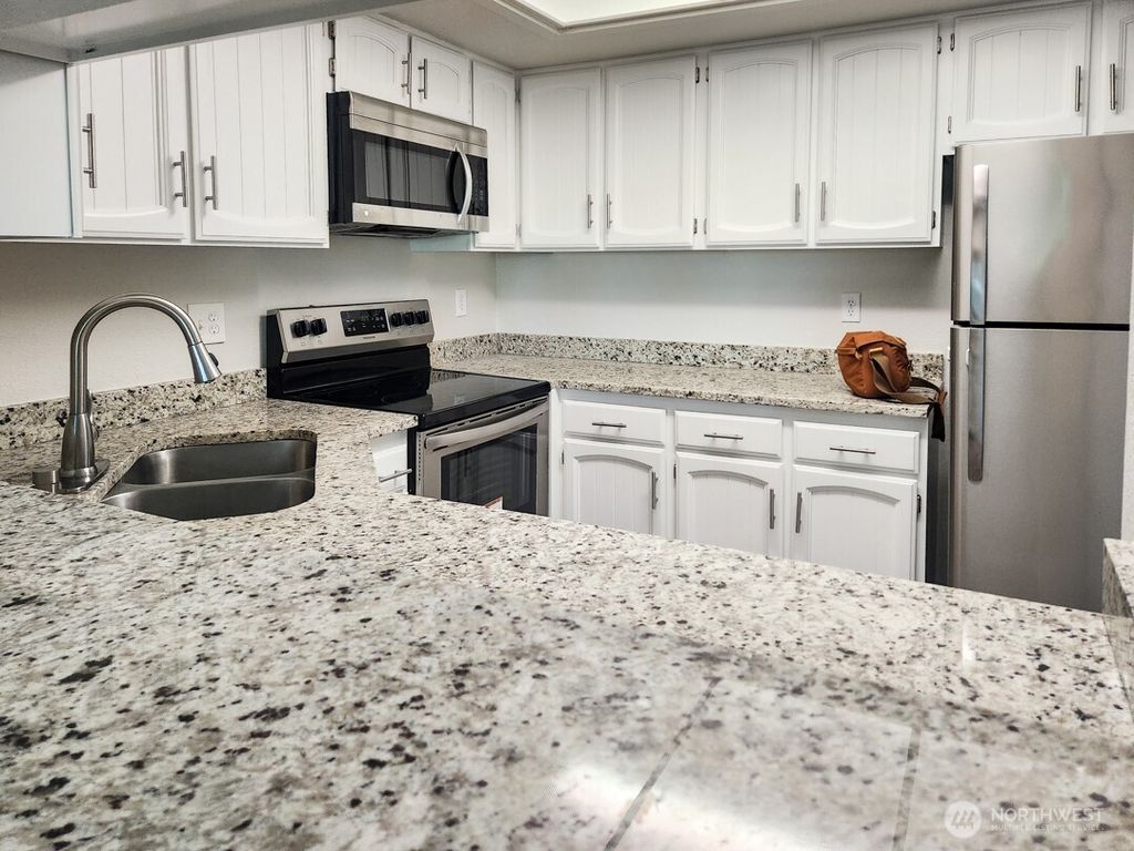 Photo of 2611 NE 4th Street #234, Renton, WA 98056 (MLS # 2388434)