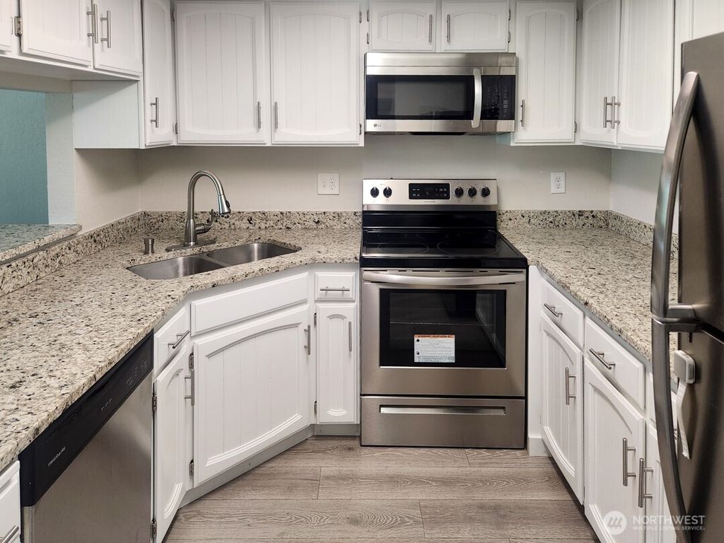 Photo of 2611 NE 4th Street #234, Renton, WA 98056 (MLS # 2388434)