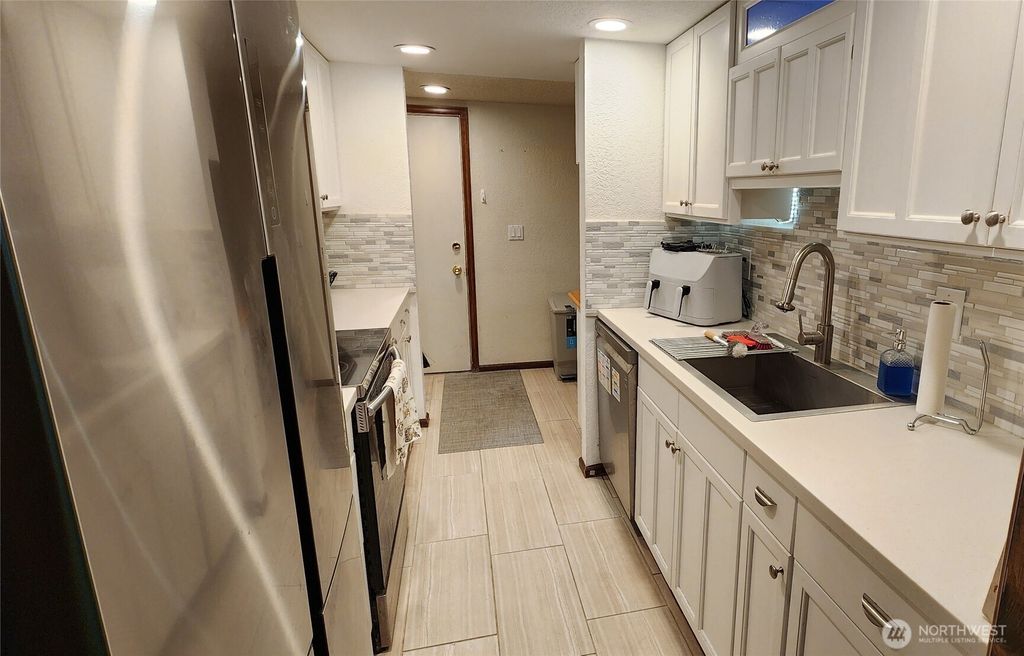 Photo of 23511 102 Avenue SE, Kent, WA 98031 (MLS # 2476905)