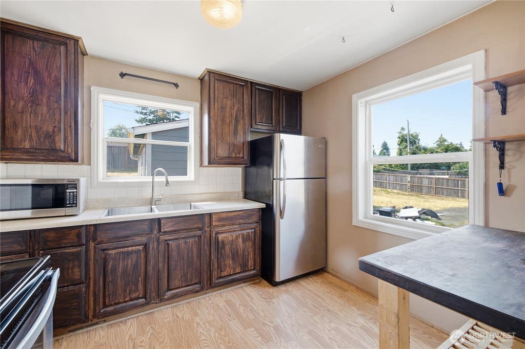 Photo of 9831 33rd Avenue SW, Seattle, WA 98126 (MLS # 2564311)