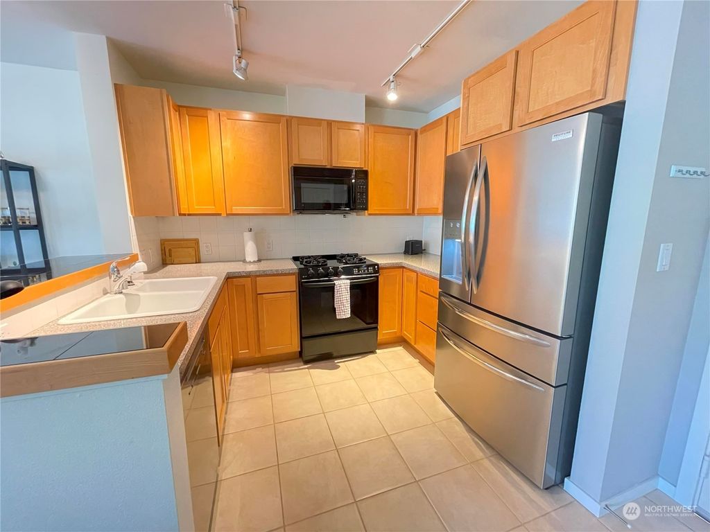 Photo of 2901 NE Blakeley Street #404, Seattle, WA 98105 (MLS # 2140780)