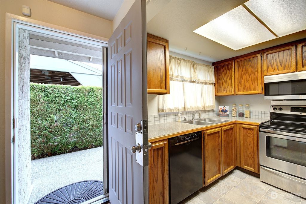 Photo of 1426 NE 151st Street #A-102, Shoreline, WA 98155 (MLS # 2199903)