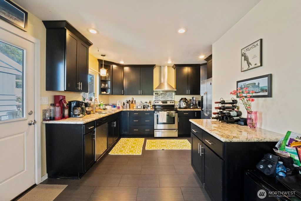 Photo of 9840 26th Avenue SW, Seattle, WA 98106 (MLS # 2443525)