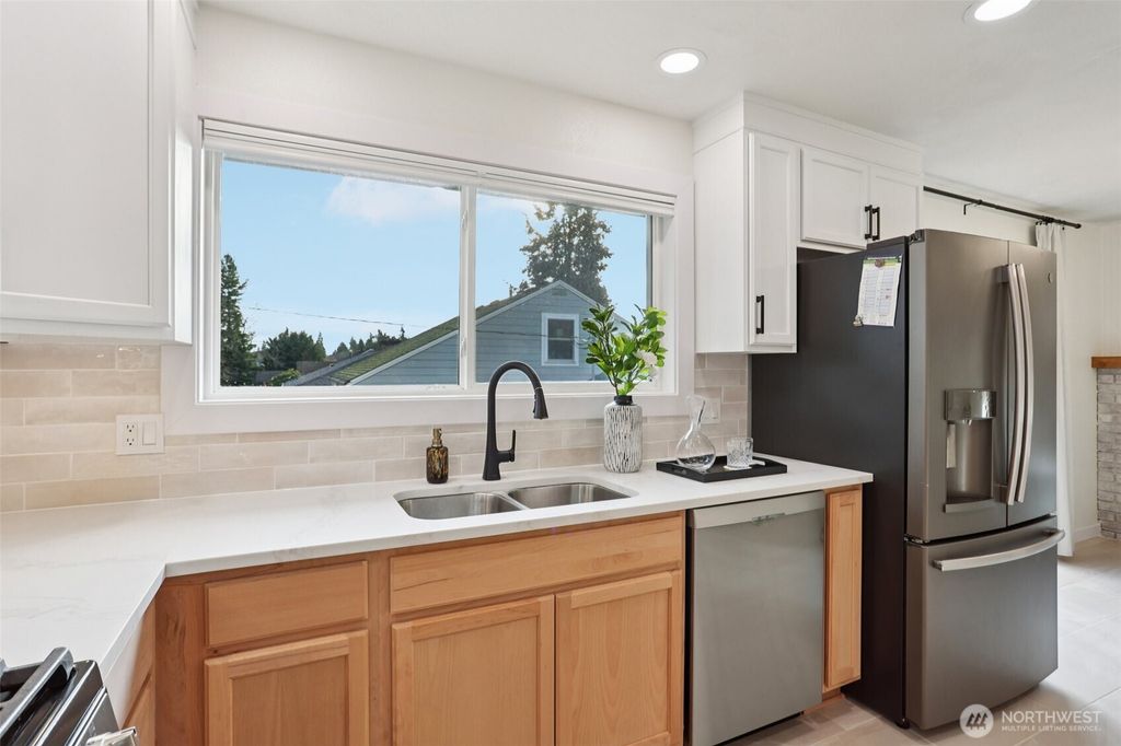 Photo of 9002 34th Avenue SW, Seattle, WA 98126 (MLS # 2462798)