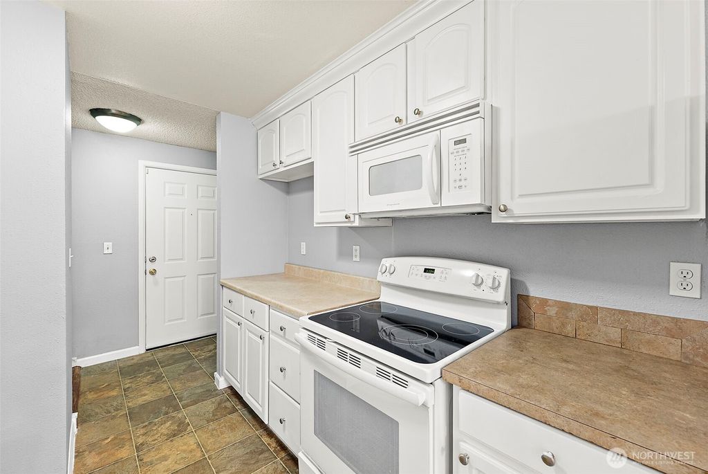 Photo of 10010 Golden Given Road E #4, Tacoma, WA 98445 (MLS # 2515698)