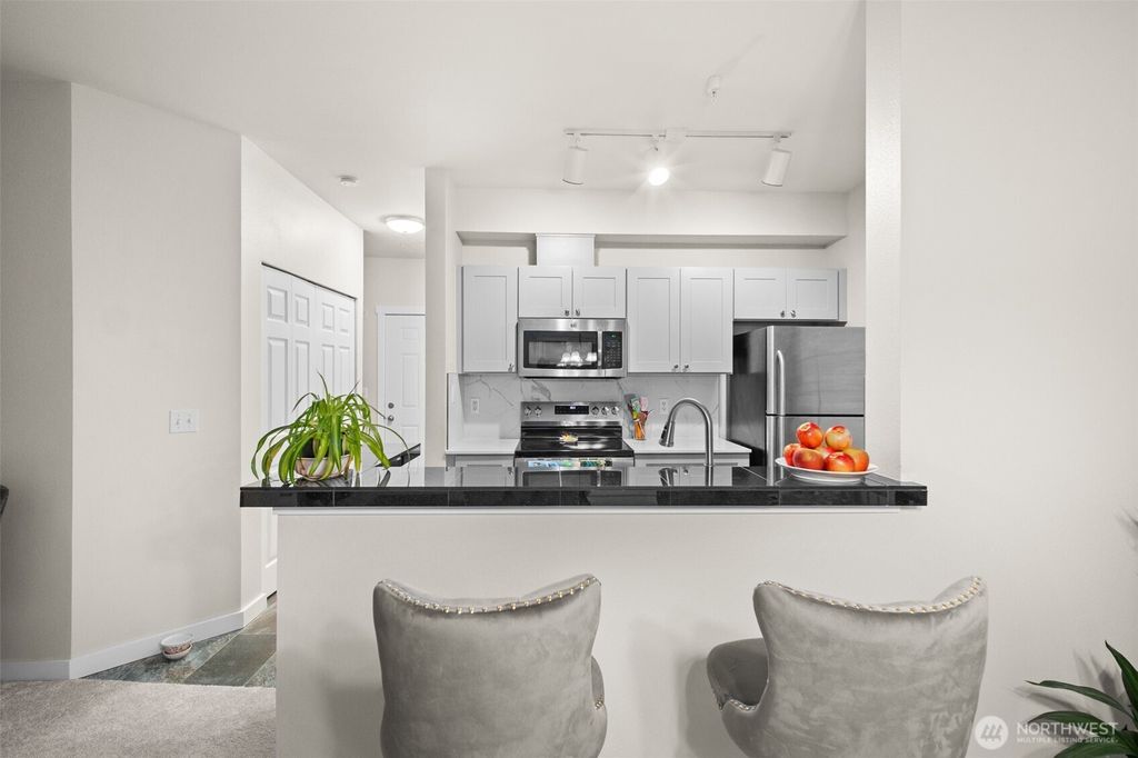 Photo of 801 Rainer Avenue N #E324, Renton, WA 98057 (MLS # 2455379)