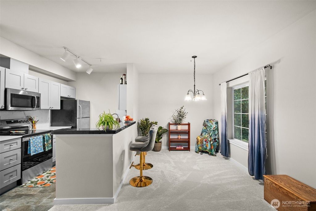 Photo of 801 Rainer Avenue N #E324, Renton, WA 98057 (MLS # 2455379)