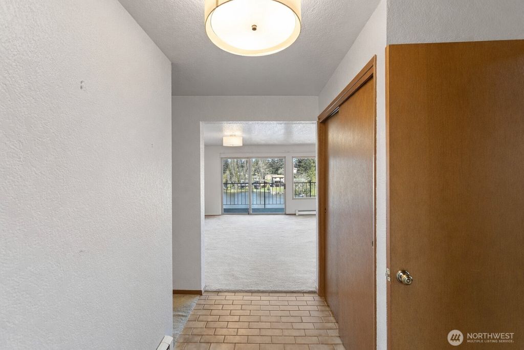 Photo of 322 N 134th St St #406, Seattle, WA 98133 (MLS # 2505495)