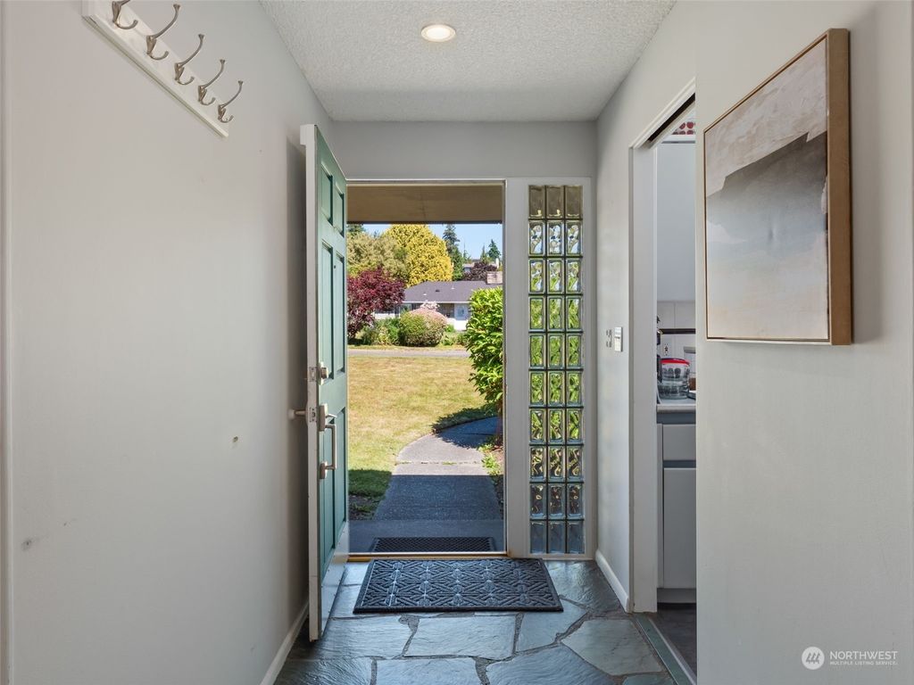 Photo of 12515 11th Avenue NW, Seattle, WA 98177 (MLS # 2257042)