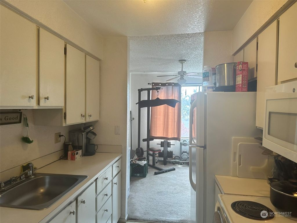 Photo of 12525 NE 145th Place #F112, Kirkland, WA 98034 (MLS # 2225822)