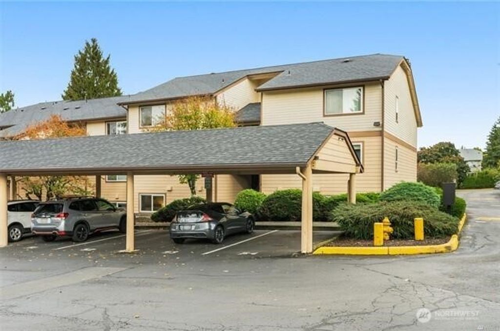 Photo of 12514 NE 142nd Lane #D-104, Kirkland, WA 98034 (MLS # 2436988)