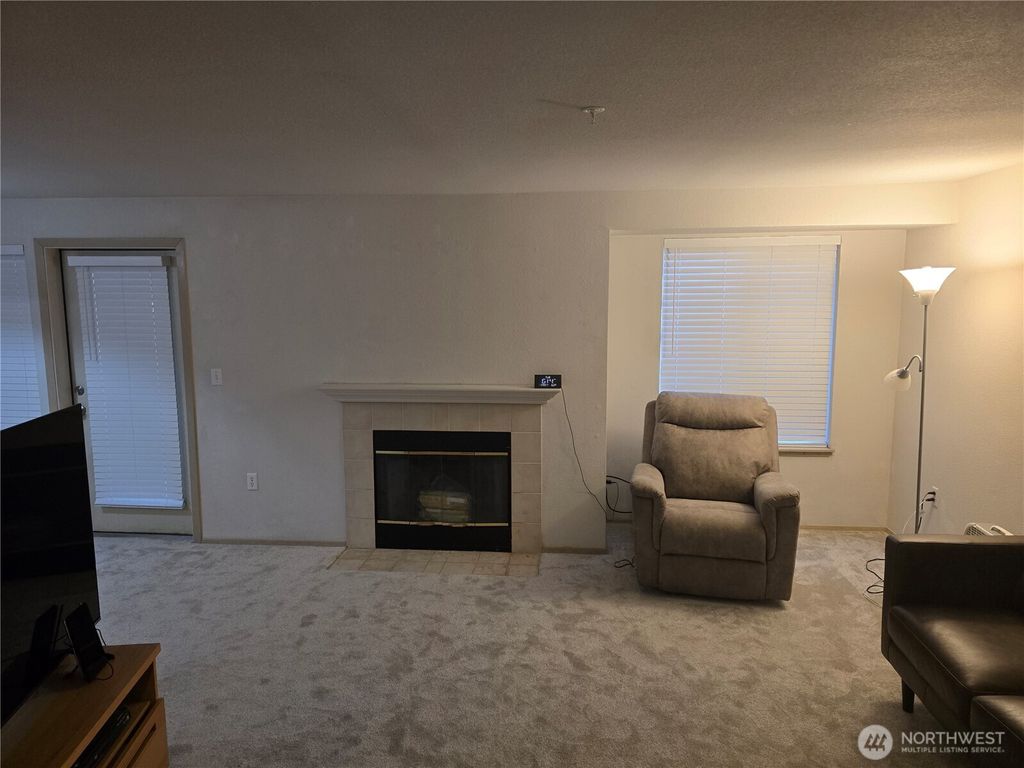 Photo of 11002 SE Petrovitsky Road #F103, Renton, WA 98055 (MLS # 2505424)