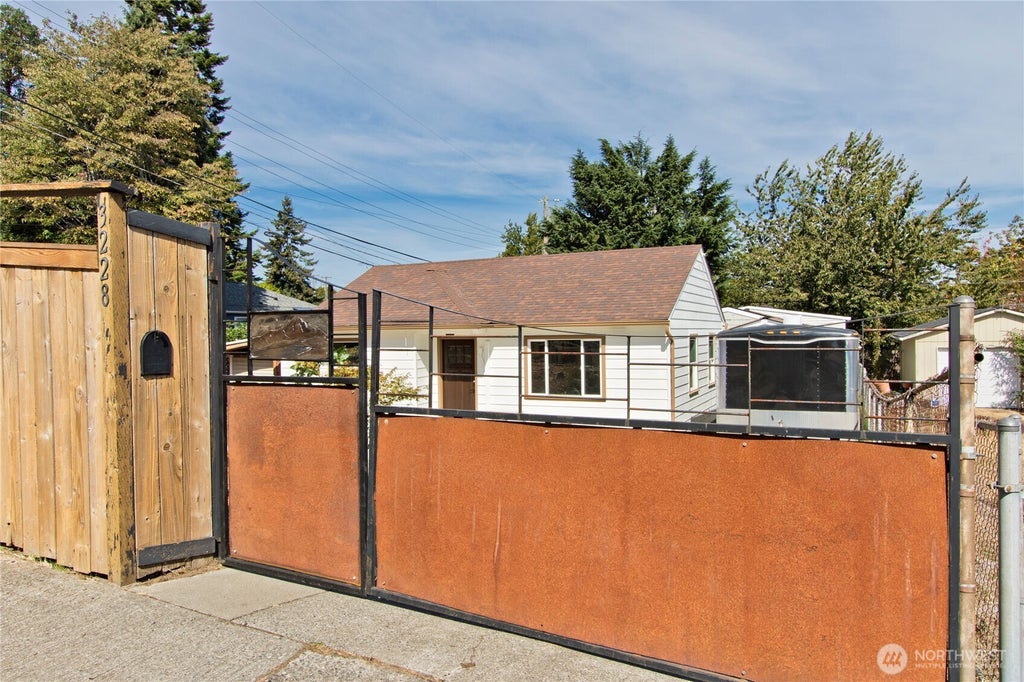 Photo of 3228 SW 97th Street, Seattle, WA 98126 (MLS # 2556396)