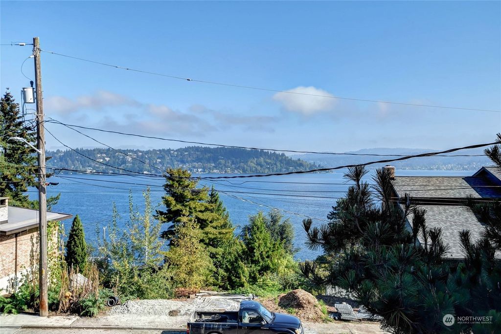 Photo of 9909 Arrowsmith Avenue S, Seattle, WA 98118 (MLS # 2131389)