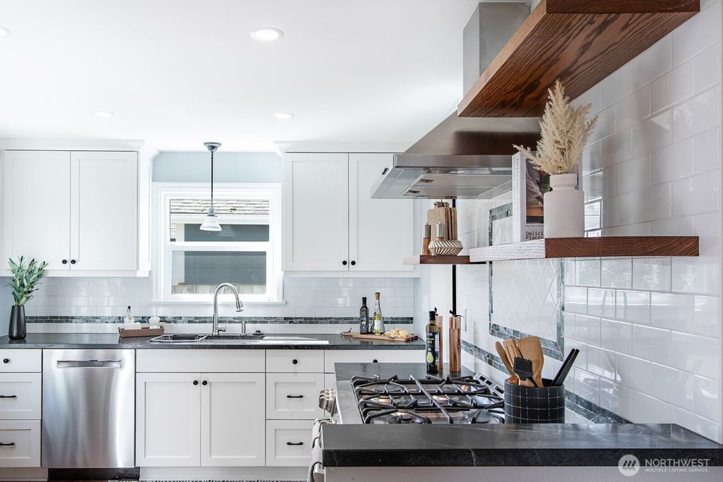 Photo of 7707 31st Avenue SW, Seattle, WA 98126 (MLS # 2356660)