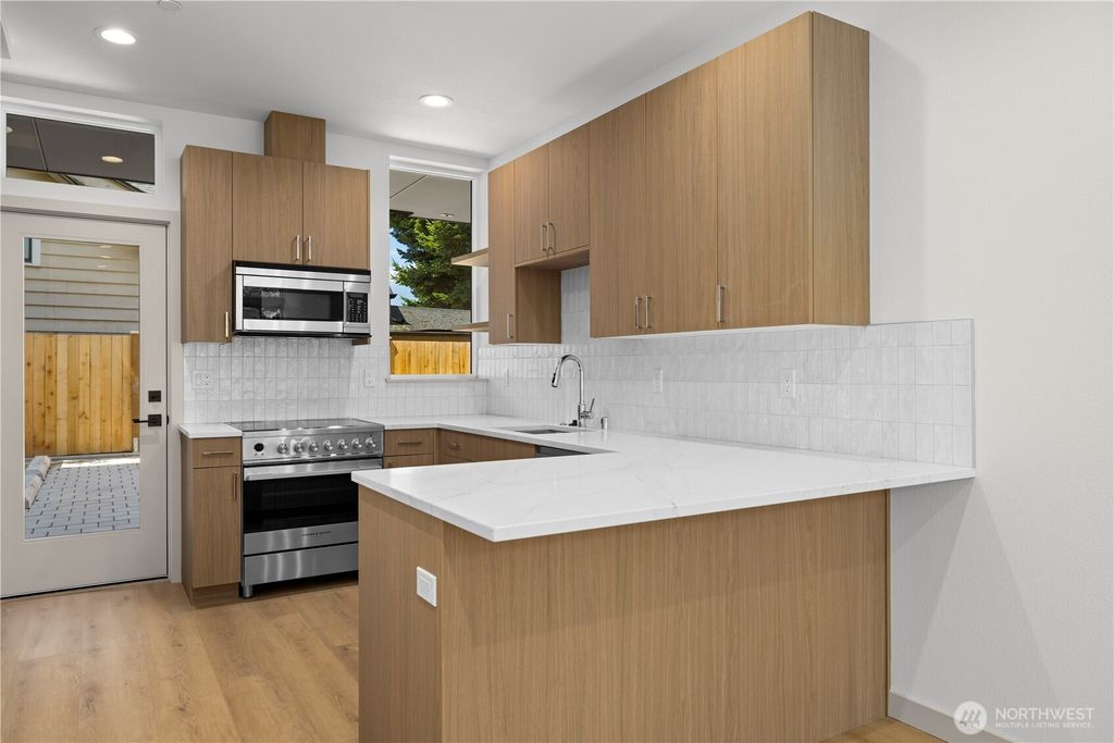 Photo of 7011 9th Avenue NE, Seattle, WA 98115 (MLS # 2490650)