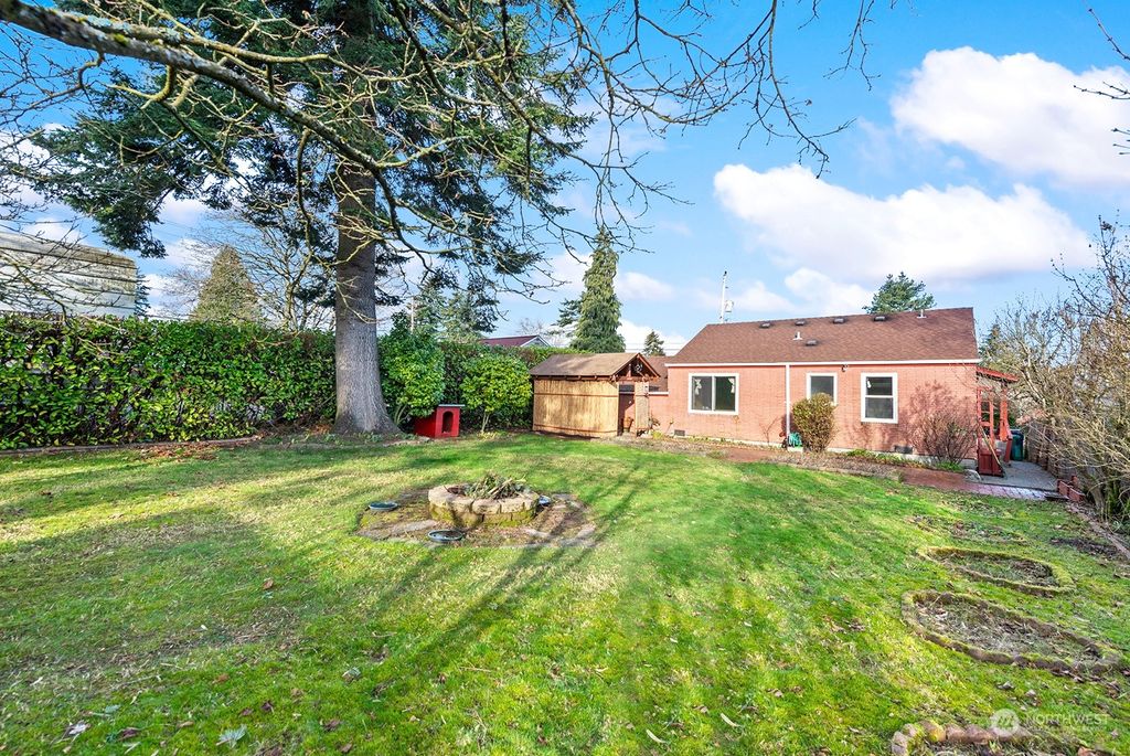 Photo of 1411 S 103rd Street, Seattle, WA 98168 (MLS # 2325258)