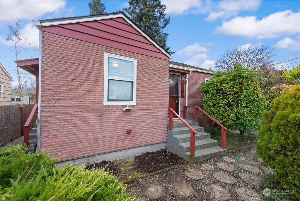 Photo of 1411 S 103rd Street, Seattle, WA 98168 (MLS # 2325258)