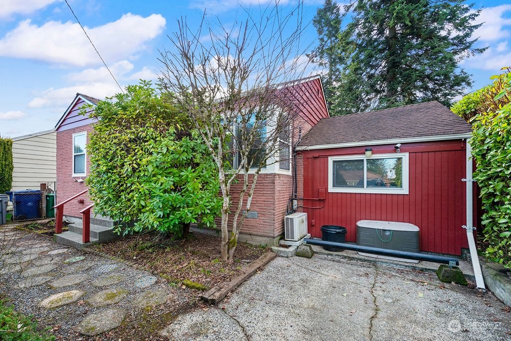 Photo of 1411 S 103rd Street, Seattle, WA 98168 (MLS # 2325258)