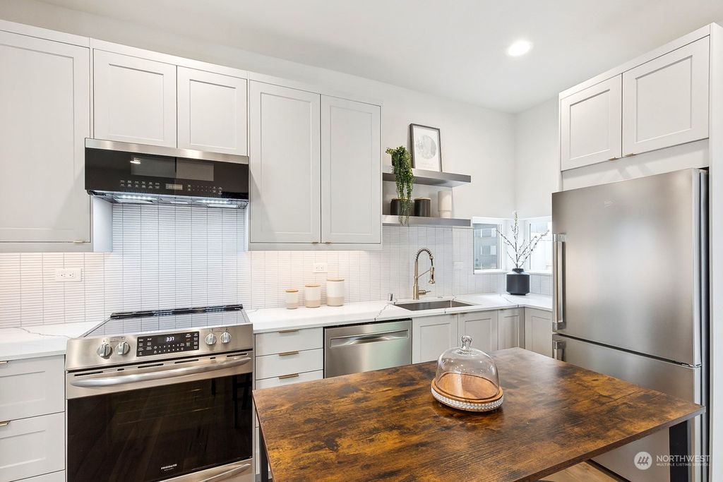 Photo of 8755 12th Avenue NW, Seattle, WA 98117 (MLS # 2179336)