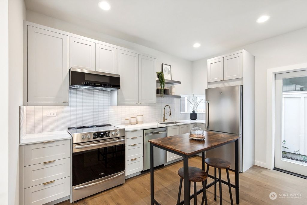 Photo of 8755 12th Avenue NW, Seattle, WA 98117 (MLS # 2179336)