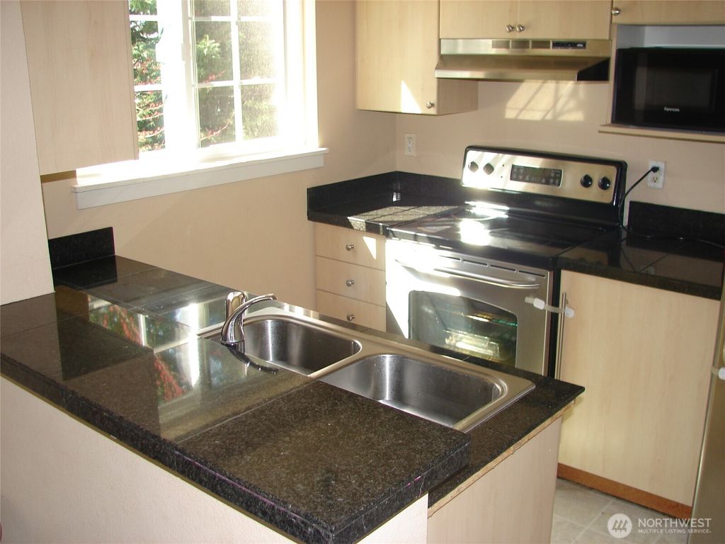 Photo of 10605 SE 261st Place #D302, Kent, WA 98030 (MLS # 2487680)