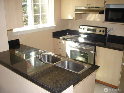 Photo of 10605 SE 261st Place #D302, Kent, WA 98030 (MLS # 2487680)