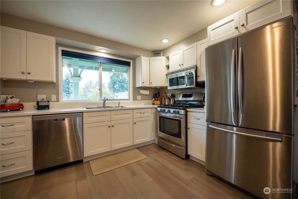 Photo of 12724 83rd Court NE, Kirkland, WA 98034 (MLS # 2219649)